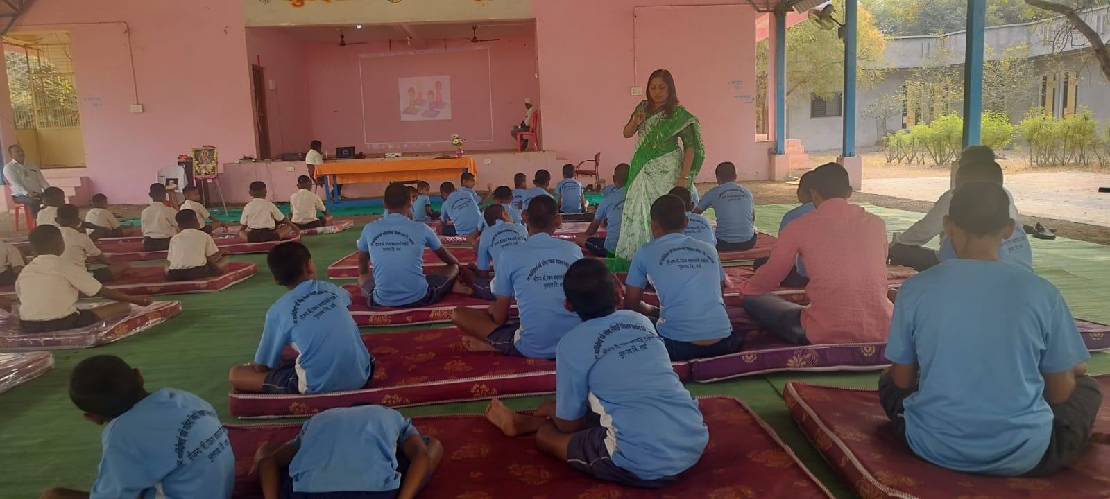 Staff member leading an interactive awareness session with students